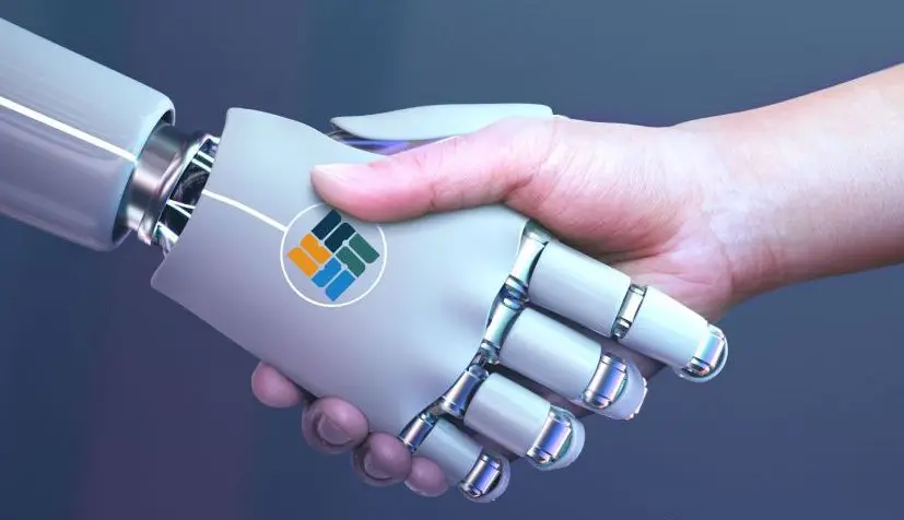 A human hand shakes hands with a robotic hand, symbolizing human-robot collaboration.