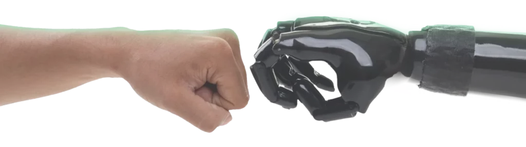 A human fist and a black robotic hand are about to fist bump, depicted against a plain white background.